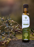 ITALOIL 250ml extra virgin olive oil bottle in an Italian olive grove