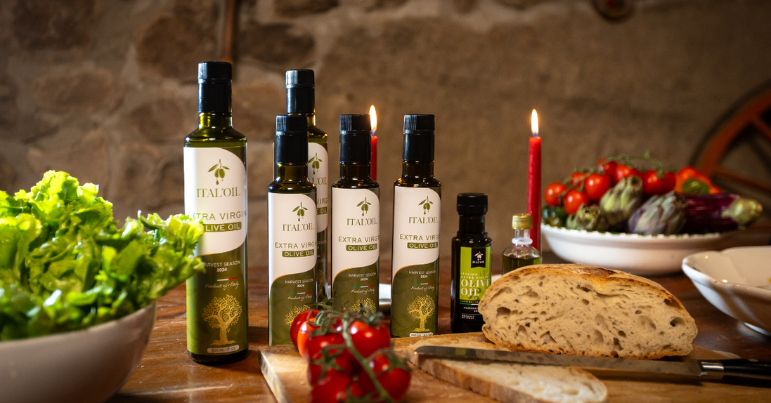 ITALOIL olive oil bottles with bread and vegetables on a table
