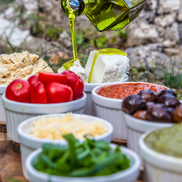 Italian antipasto paired with bright green extra virgin olive oil