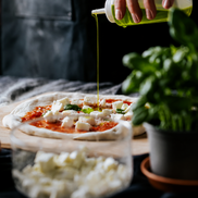 Italian focaccia finished with bright green extra virgin olive oil