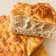 Square ITALOIL olive oil focaccia with a golden crust and airy crumb