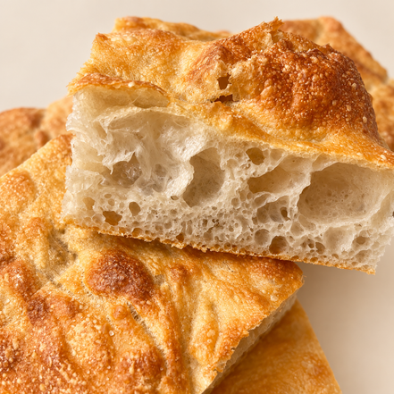 Square ITALOIL olive oil focaccia with a golden crust and airy crumb