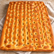 Large handmade ITALOIL olive oil focaccia with a golden dimpled crust